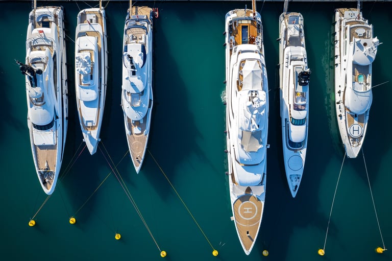Aerial view of Super Mega Yachts in the French Riviera in the port of Antibes - Aerial sunrise flyover some of the most Expensive Boats in the World